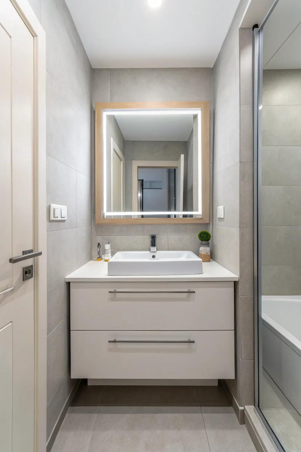 A small modern bathroom showcasing a floating vanity for a spacious feel.