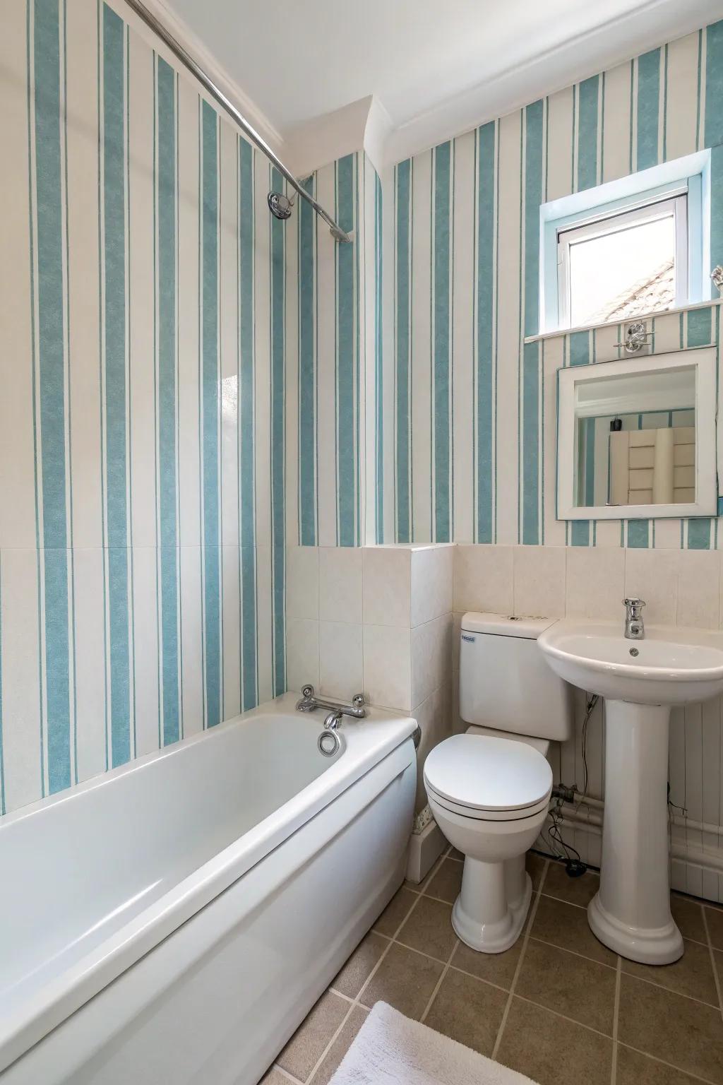 Vertical stripes give the illusion of height in this compact bathroom.