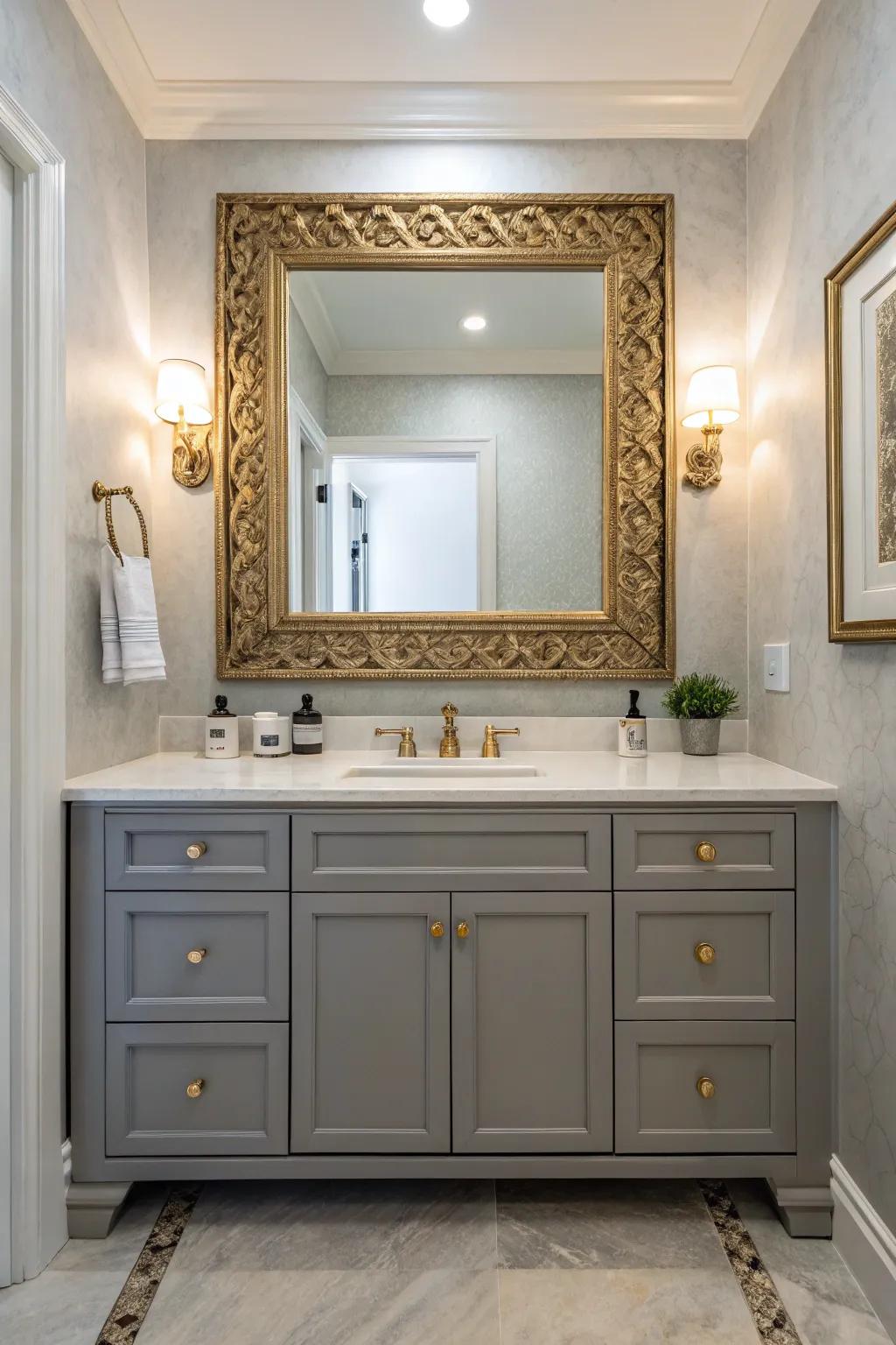 A sophisticated bathroom with a gray vanity highlighted by a statement mirror.