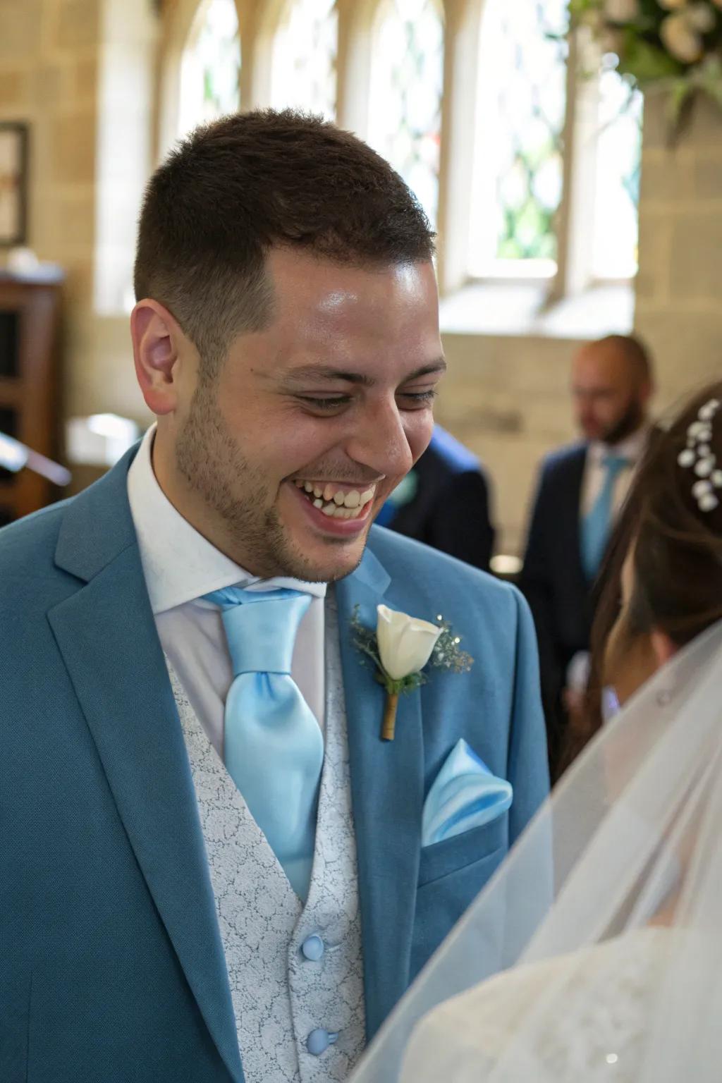 Baby blue accessories add a stylish touch to the groom's attire.