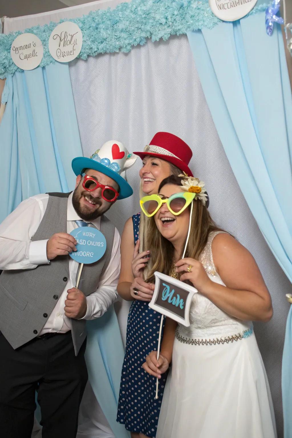 A blue-themed photo booth creates fun and memorable moments.