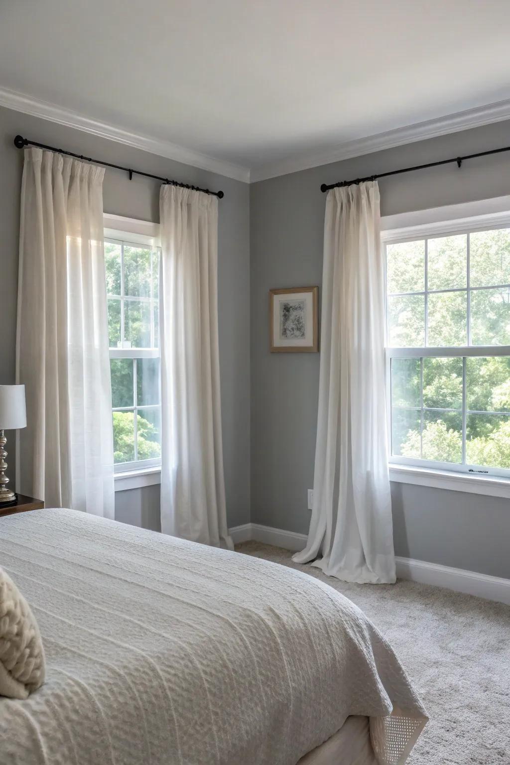 Sheer curtains soften the look of a Revere Pewter bedroom.