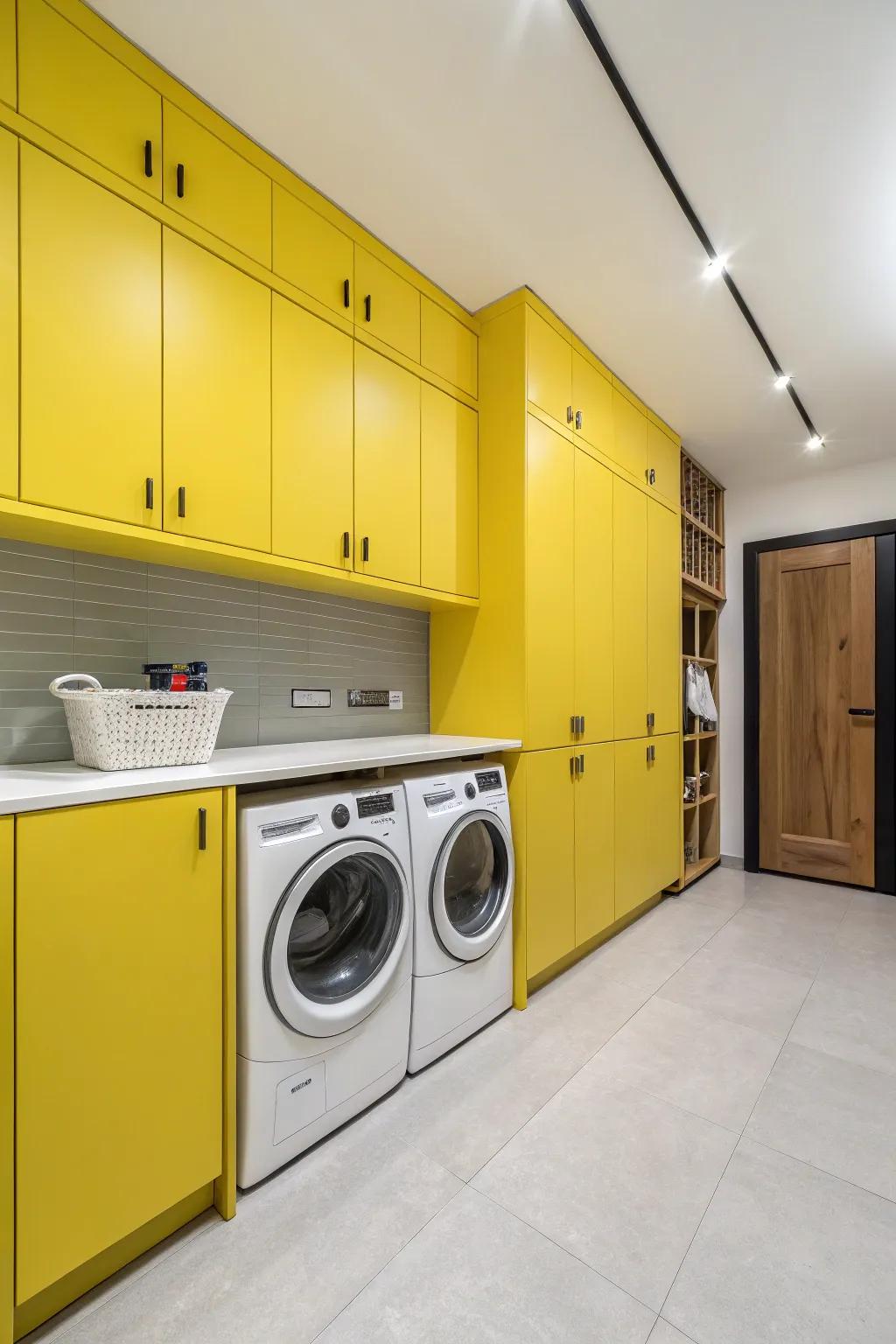 A cheerful utility room with yellow cabinets.