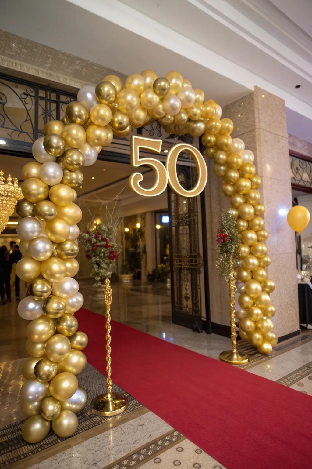 An attractive golden balloon arch that welcomes attendees to the celebration.