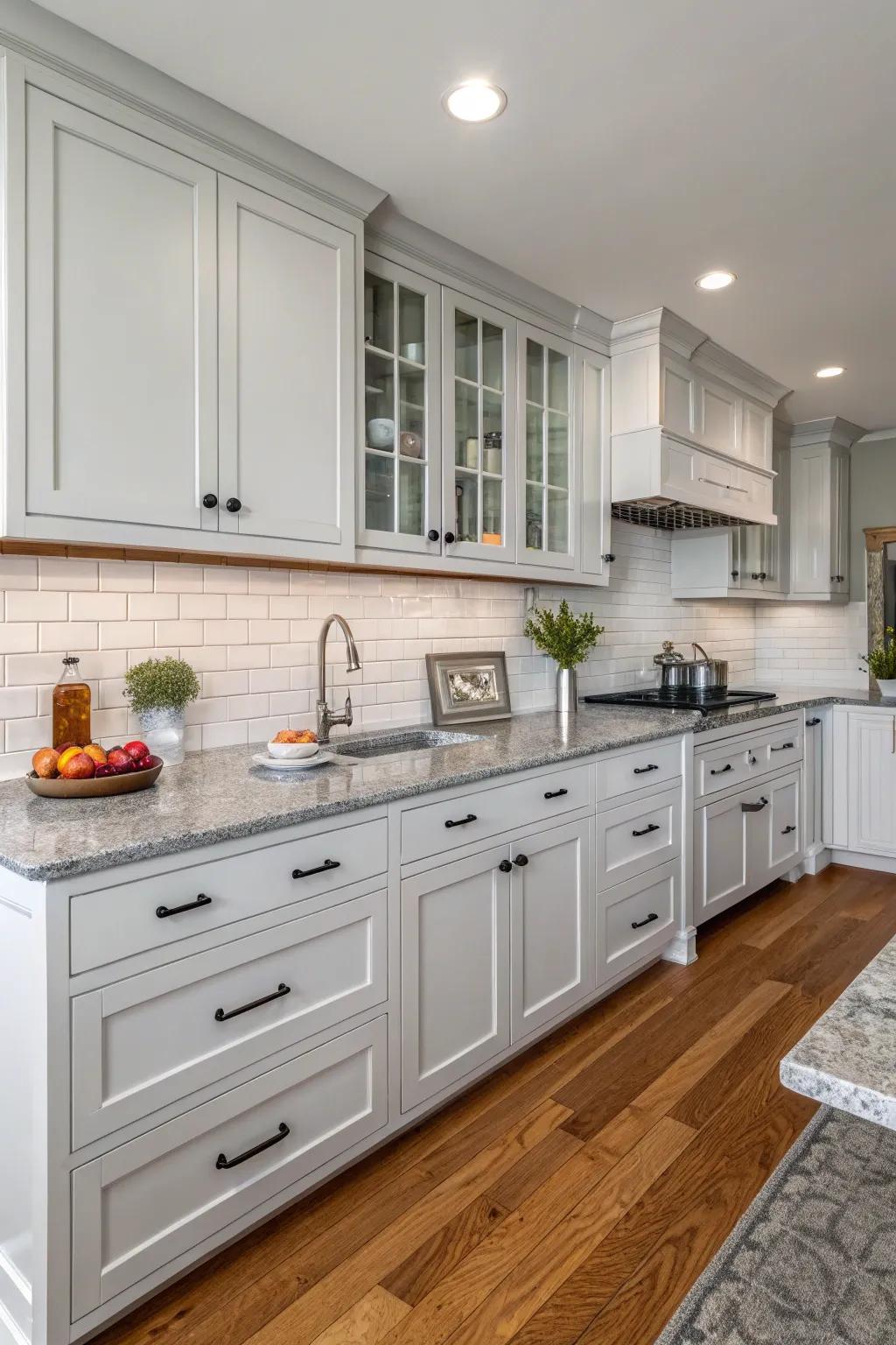 Grey countertops beautifully complementing white cabinetry.