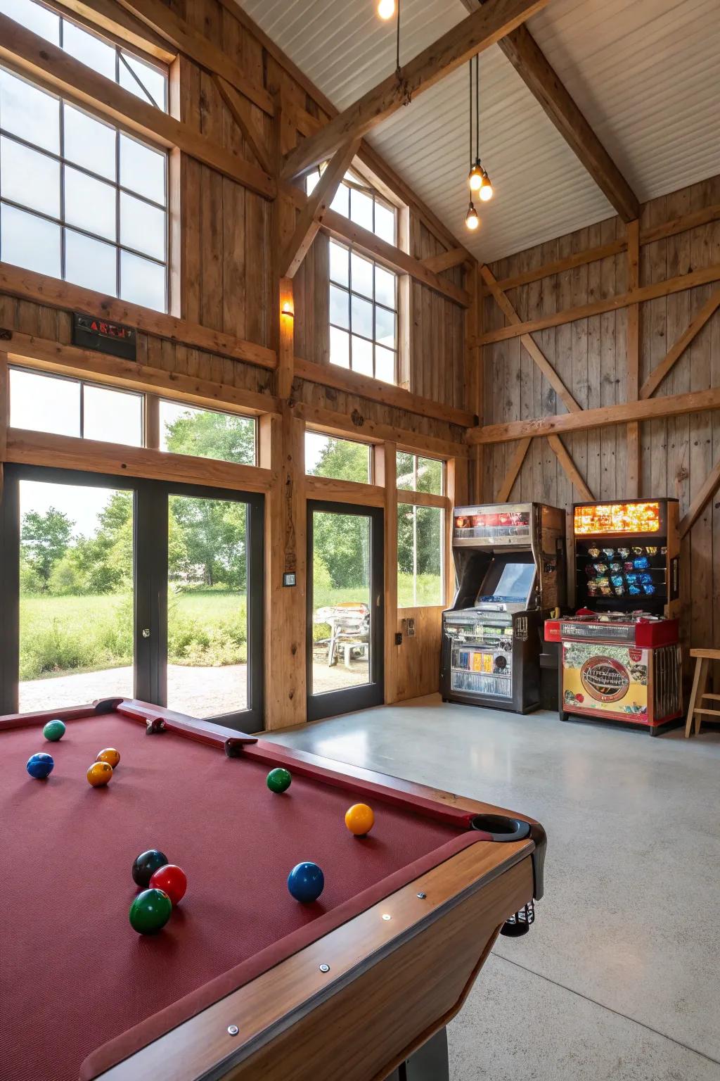 A recreation room in a pole barn featuring a billiard table and vintage arcade games.