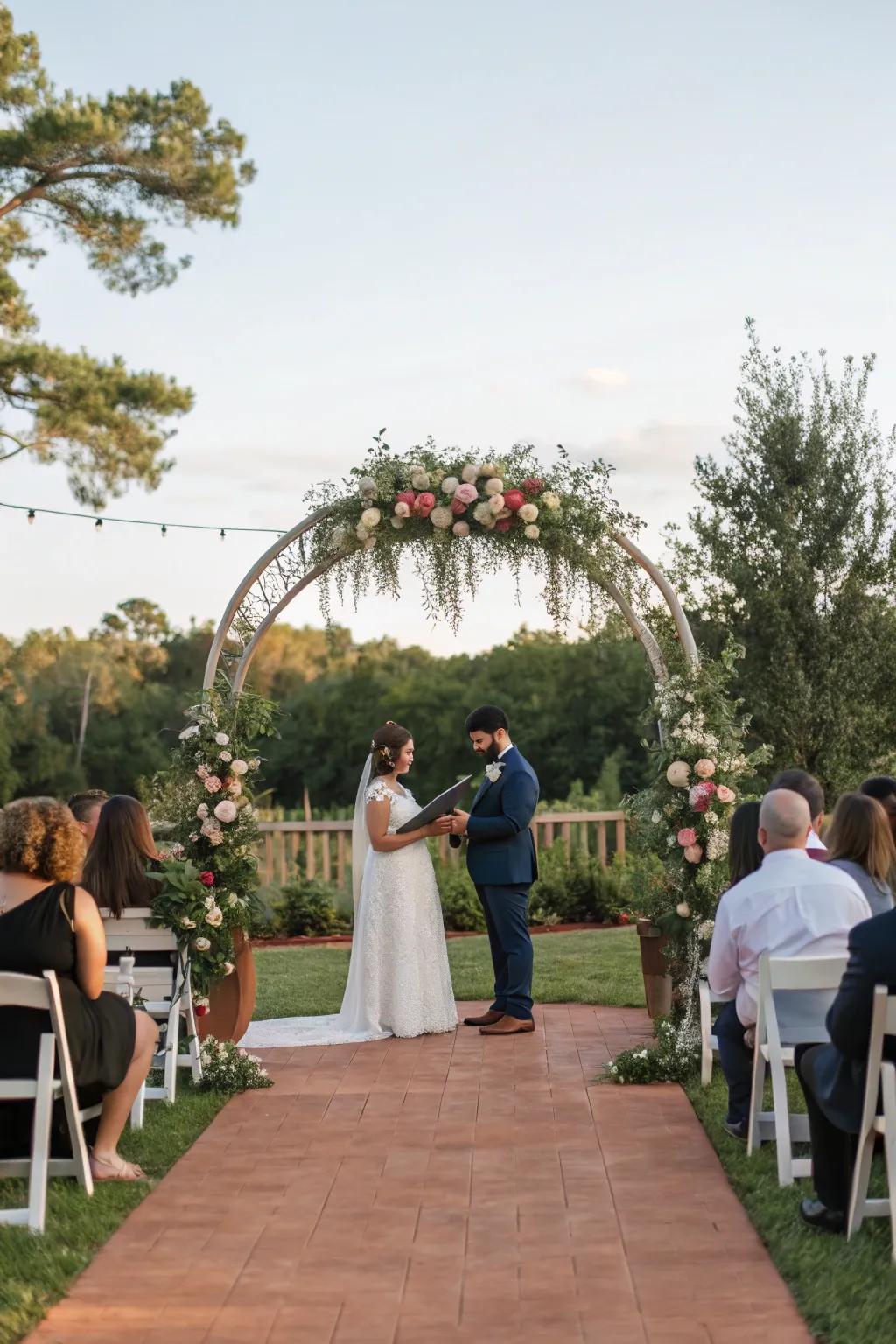 An outdoor wedding ceremony featuring a beautifully decorated arch.