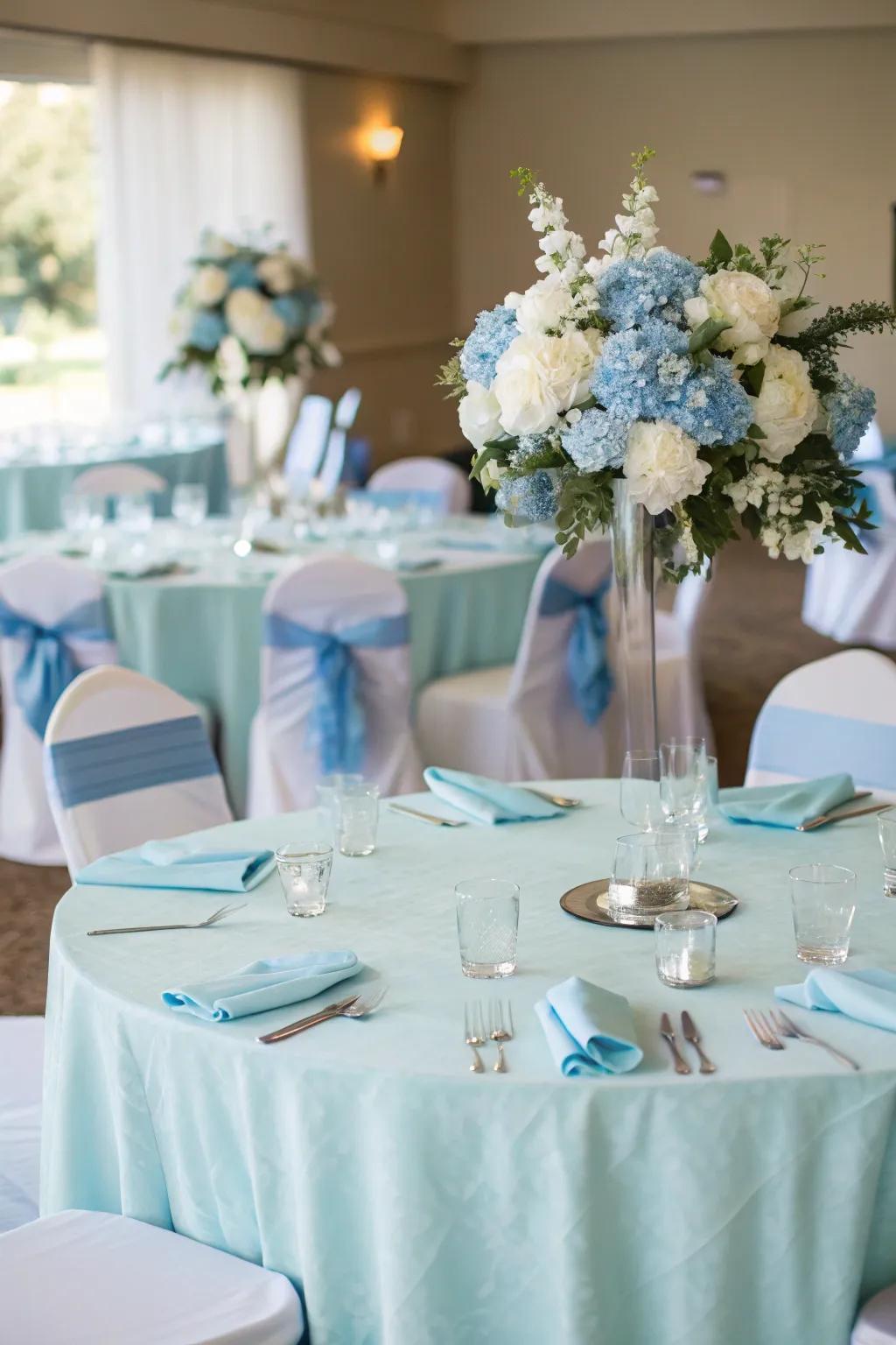 Baby blue reception decor creates a cohesive and elegant theme.