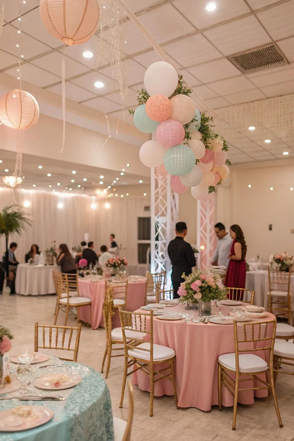 A dreamy indoor party with pastel decorations and table settings.