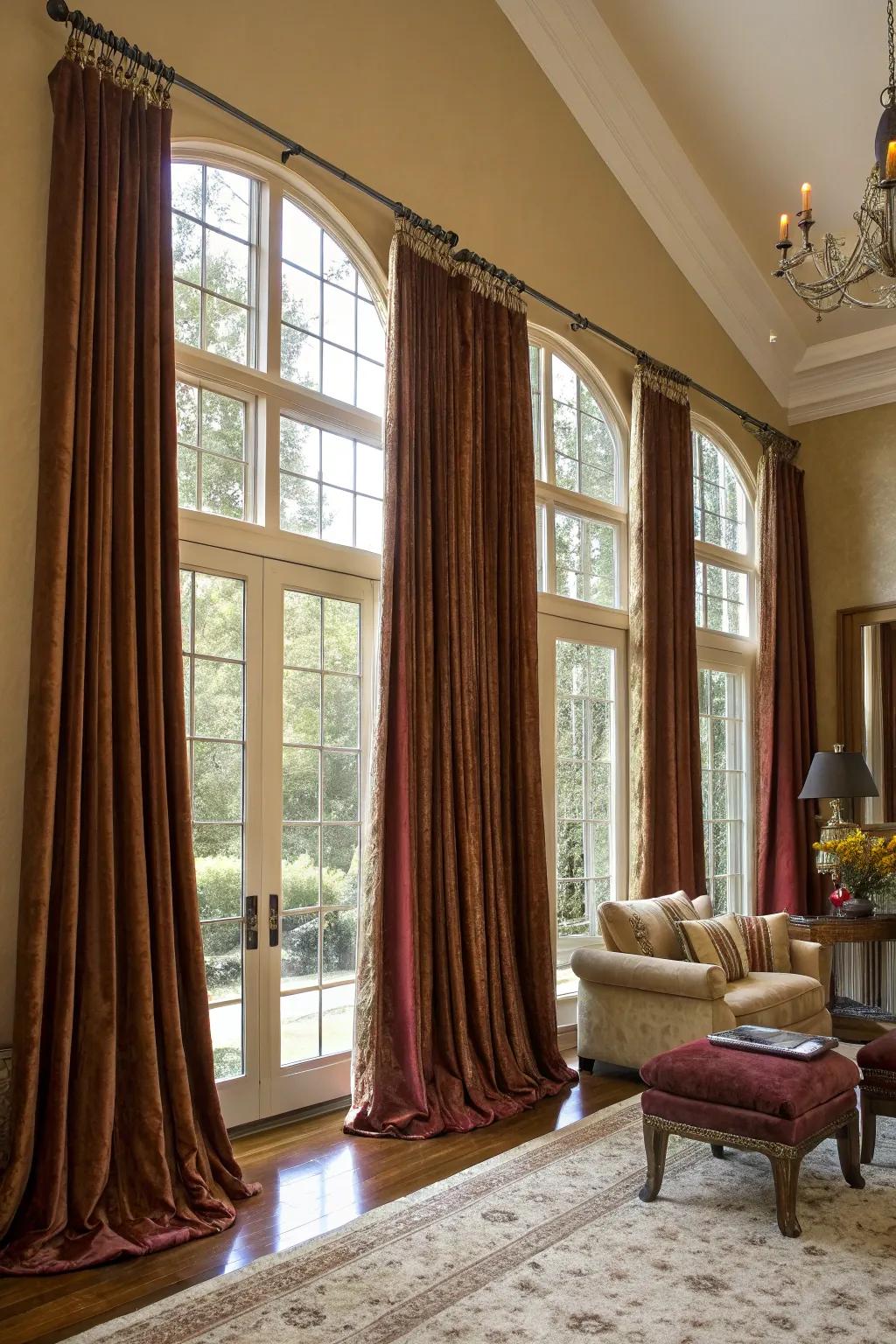 Floor-to-ceiling drapes add height and drama.