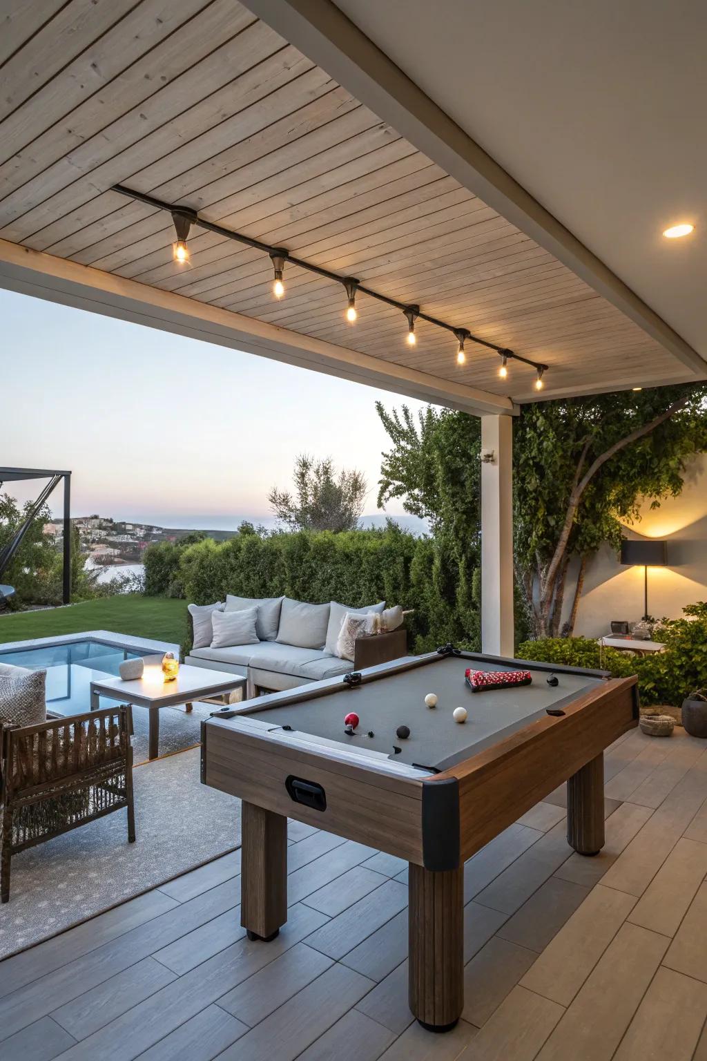 A multi-functional outdoor area with a pool table and relaxing lounge.