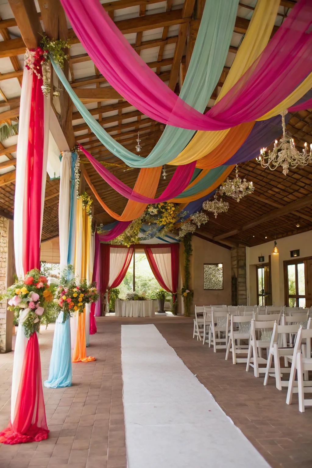 A wedding venue adorned with vibrant rainbow drapery.