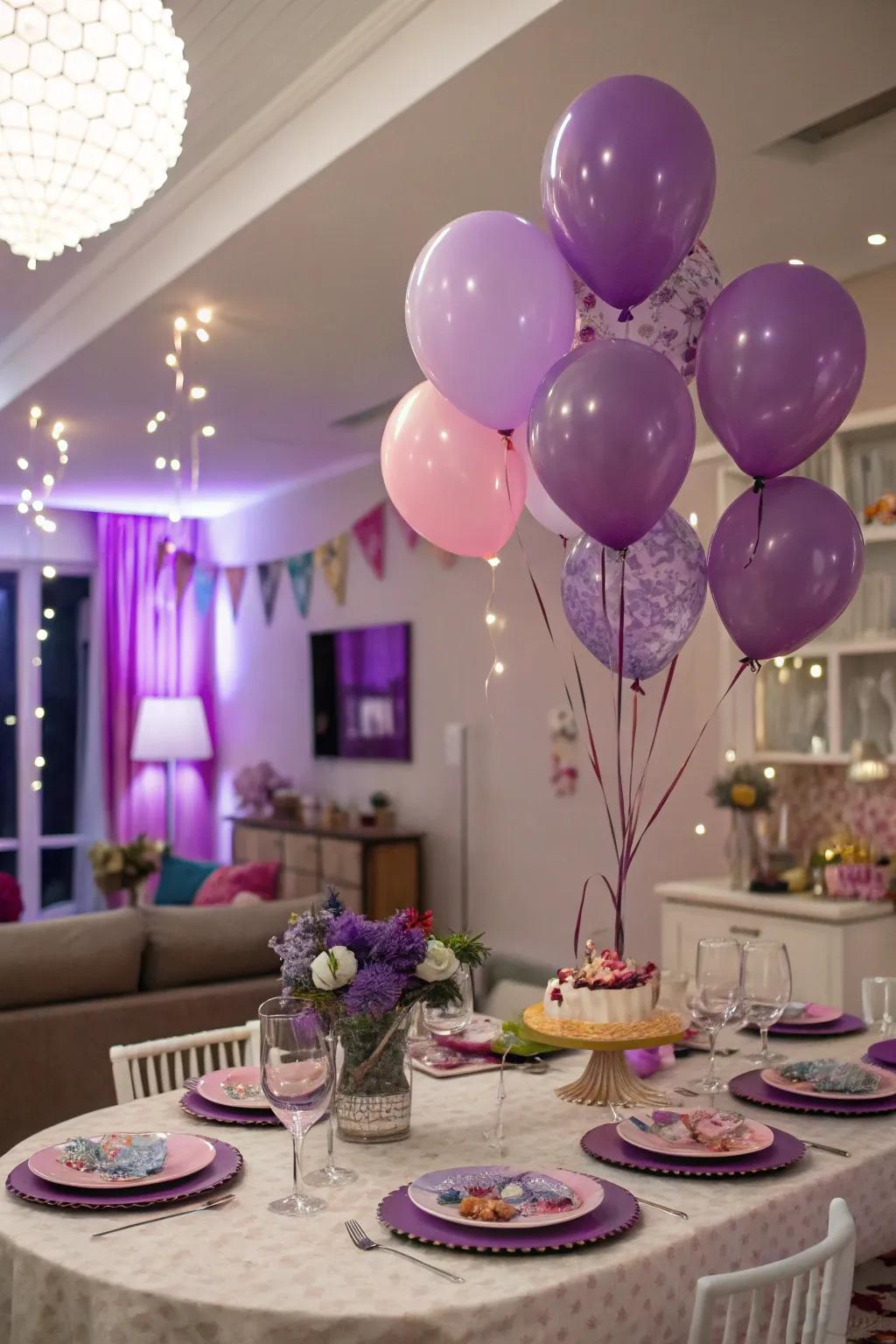 A celebratory setting beautifully enhanced with purple inflatables and serveware.