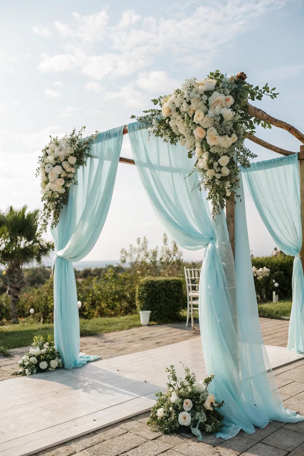 A baby blue wedding arch creates a stunning ceremony focal point.