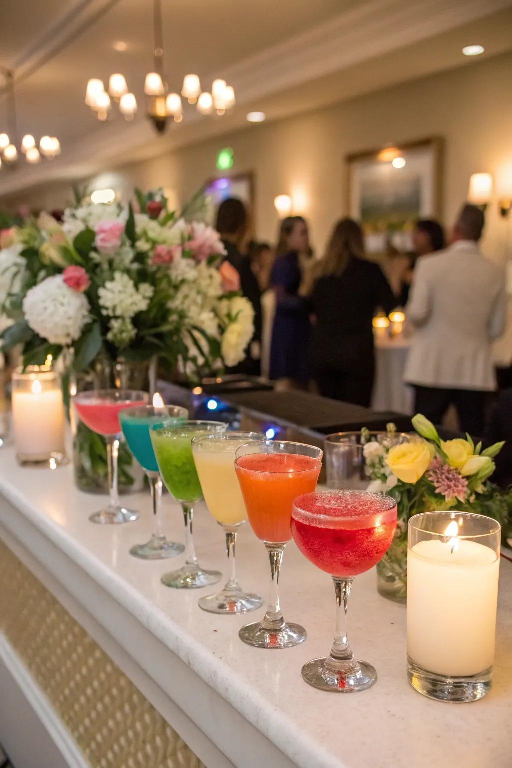 A selection of rainbow-themed cocktails at a wedding reception.